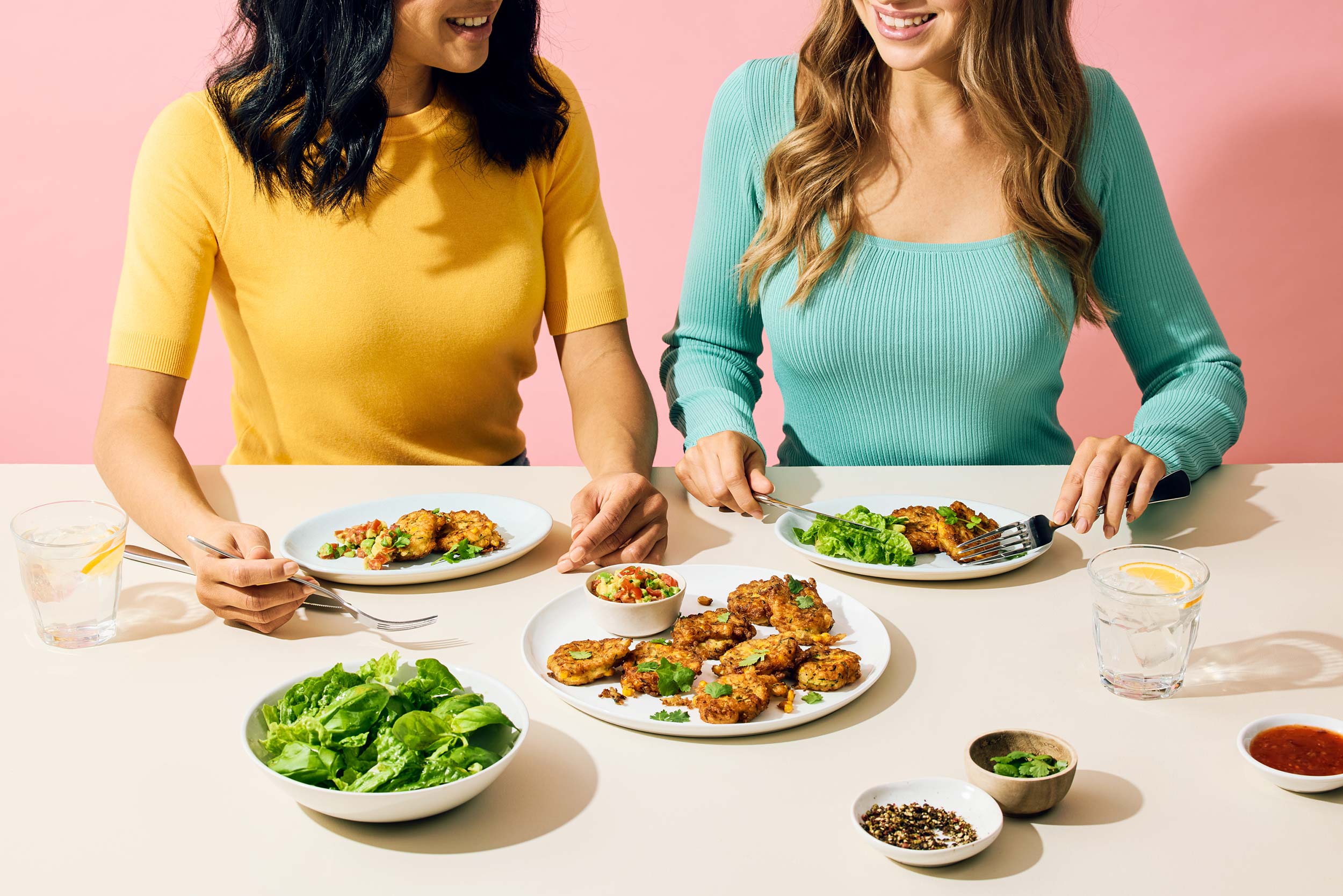 So Good two women table food Corn Courgette Fritters
